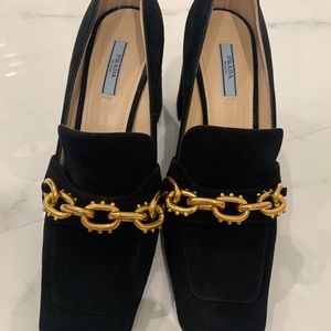 Prada with a chunky heel. Black with gold buckle.